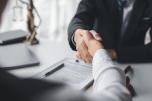 Lawyer shaking hands with a client