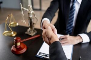 Lawyer and client shaking hands