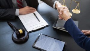 Professional lawyer advising a client on a commercial contract in a legal service office. Justice, law, attorney, and court judge concept.