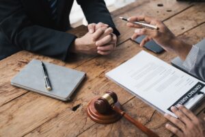 Close-up of a lawyer providing legal advice to a client in a law firm.