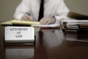 Young attorney lawyer at desk businessman negotiations