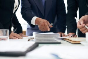 Lawyer presenting evidence from documents to a coworker.