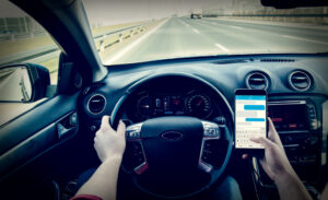 Dangerous driving while writing SMS text message